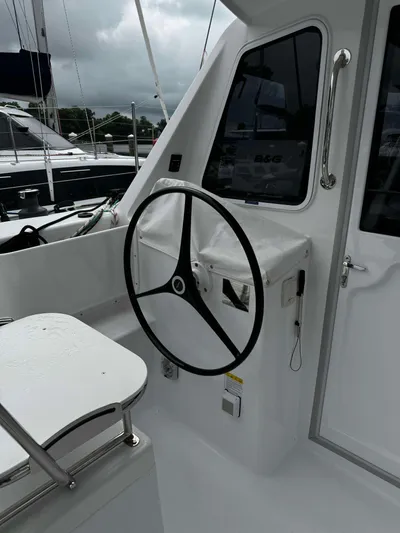 Shared Adventure Yacht Photos Pics Steering wheel of a 2023 Seawind 1160 Lite catamaran.