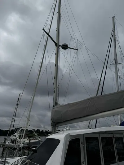 Shared Adventure Yacht Photos Pics Seawind 1160 Lite 2023 catamaran docked under cloudy skies.