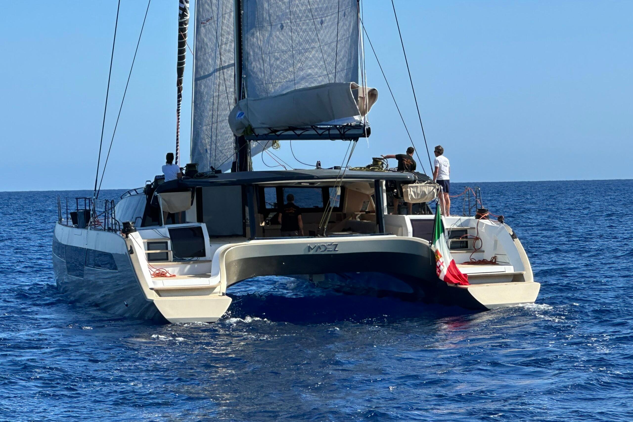 Sailing catamaran Comar C-CAT 65, 2026 model, cruising on open sea.