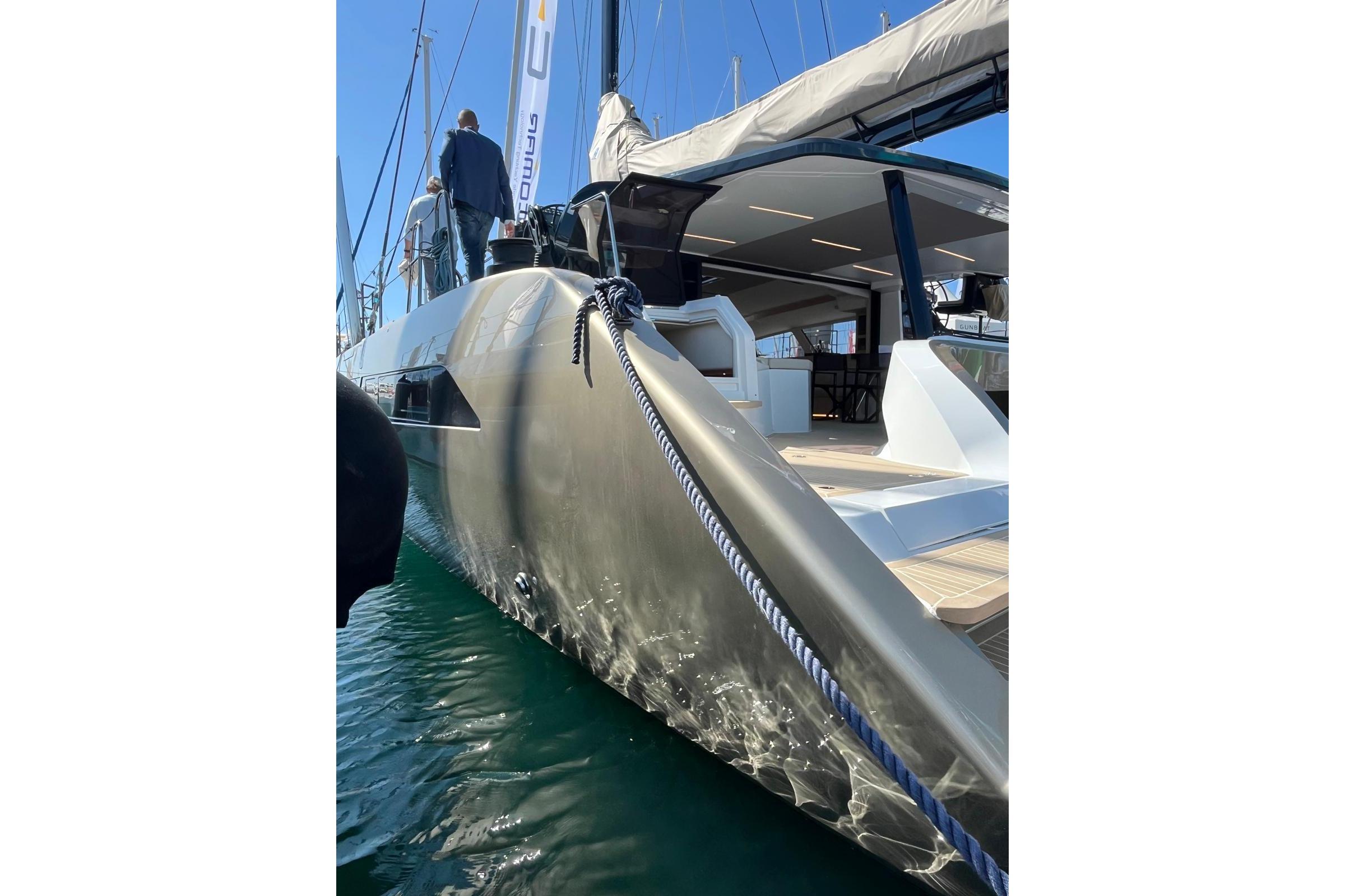 2026 Comar C-CAT 65 catamaran docked, showcasing sleek design and modern features.
