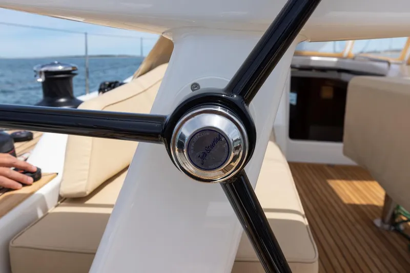 *previous Name Reserved Yacht Photos Pics Steering wheel of 2019 Nautor Swan 48 yacht, featuring sleek design and luxurious interior.