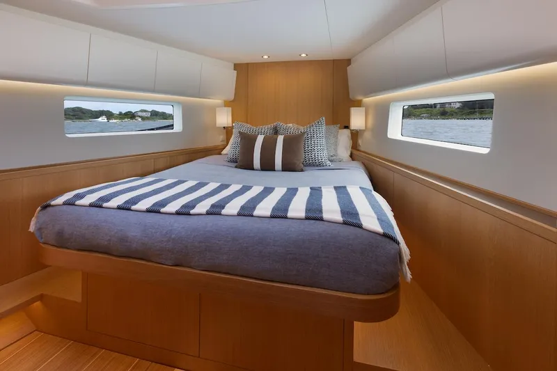 *previous Name Reserved Yacht Photos Pics Luxurious cabin interior of 2019 Nautor Swan 48 yacht with cozy bed and modern design.
