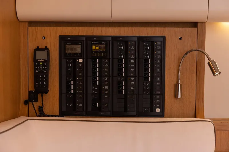 *previous Name Reserved Yacht Photos Pics Control panel on 2019 Nautor Swan 48 yacht, featuring communication device and reading light.