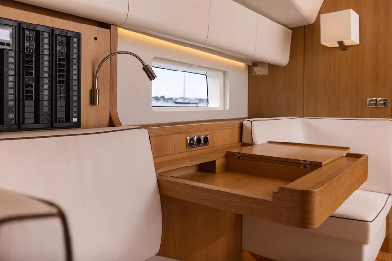 *previous Name Reserved Yacht Photos Pics Luxurious interior of 2019 Nautor Swan 48 yacht with elegant wood and leather seating.