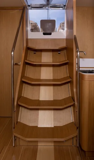 *previous Name Reserved Yacht Photos Pics Staircase inside 2019 Nautor Swan 48 yacht, featuring elegant wooden design and modern finish.