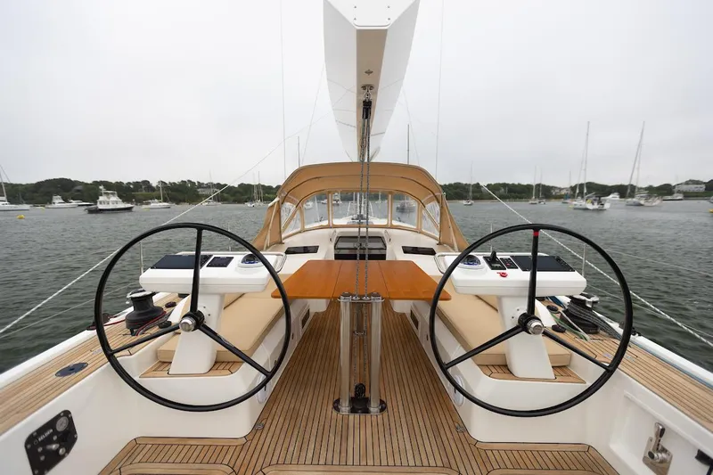 *previous Name Reserved Yacht Photos Pics 2019 Nautor Swan 48 yacht cockpit with dual steering wheels and teak decking.
