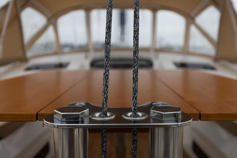 *previous Name Reserved Yacht Photos Pics Nautor Swan 48 yacht deck, featuring ropes and polished wood, 2019 model.