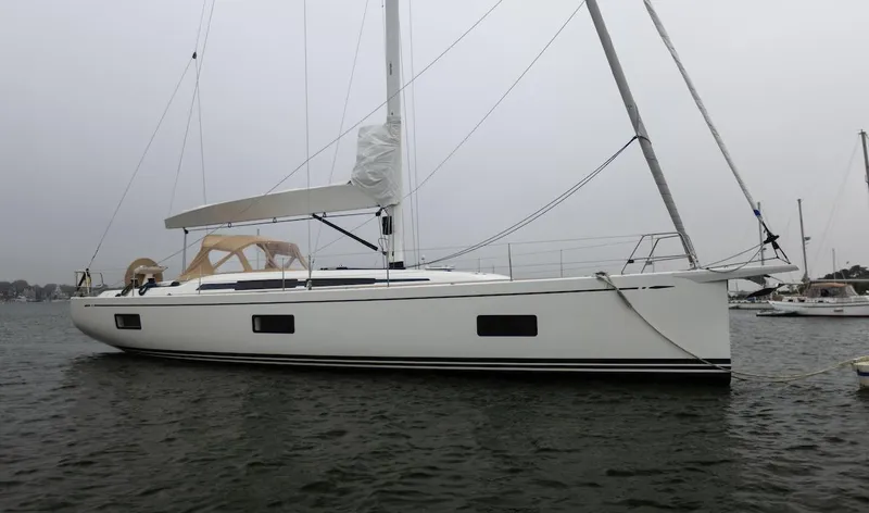 *previous Name Reserved Yacht Photos Pics 2019 Nautor Swan 48 sailboat on calm water, showcasing sleek design and modern features.