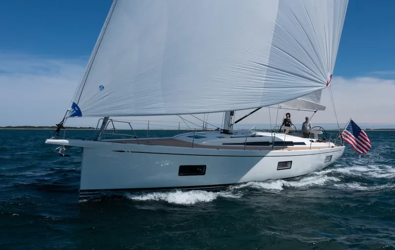 *previous Name Reserved Yacht Photos Pics Sailing yacht Nautor Swan 48, 2019 model, cruising on open water with American flag.