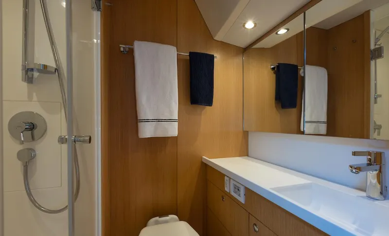 *previous Name Reserved Yacht Photos Pics Luxurious bathroom in 2019 Nautor Swan 48 yacht with modern fixtures and wooden accents.