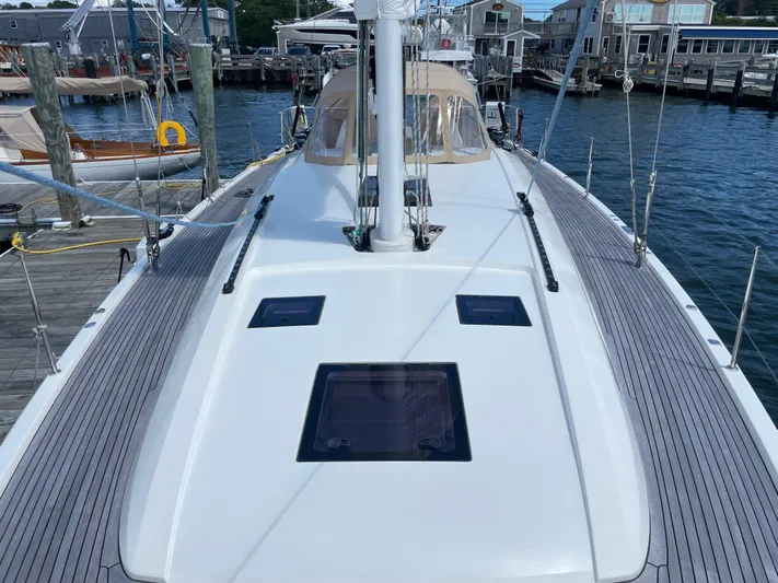 *previous Name Reserved Yacht Photos Pics 2019 Nautor Swan 48 yacht deck with sleek design, docked at marina.