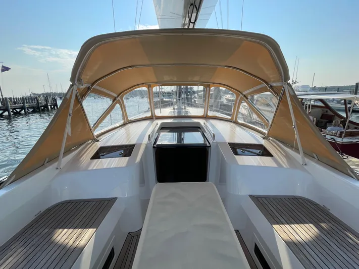 *previous Name Reserved Yacht Photos Pics Nautor Swan 48 yacht cockpit, 2019 model, with beige canopy and wooden deck.