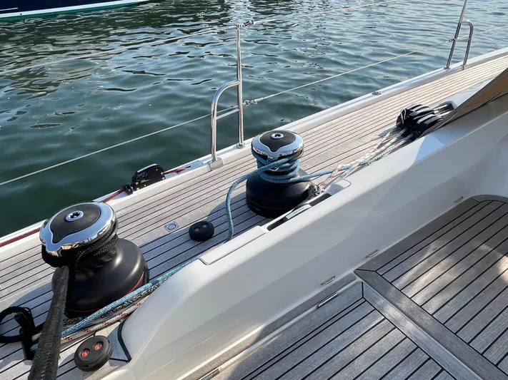 *previous Name Reserved Yacht Photos Pics Nautor Swan 48 yacht deck, 2019 model, featuring winches and ropes by the water.