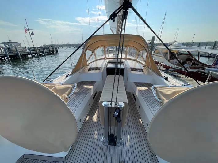 *previous Name Reserved Yacht Photos Pics Nautor Swan 48 yacht, 2019 model, docked with beige canopy and sleek deck design.