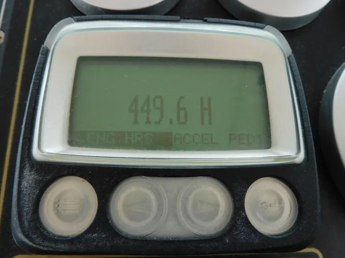 Mad Hatter Yacht Photos Pics Digital display showing 449.6 hours on a 1997 Tiara Yachts Open model.