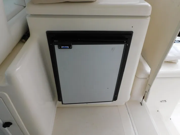 Mad Hatter Yacht Photos Pics 1997 Tiara Yachts Open interior with built-in mini fridge.