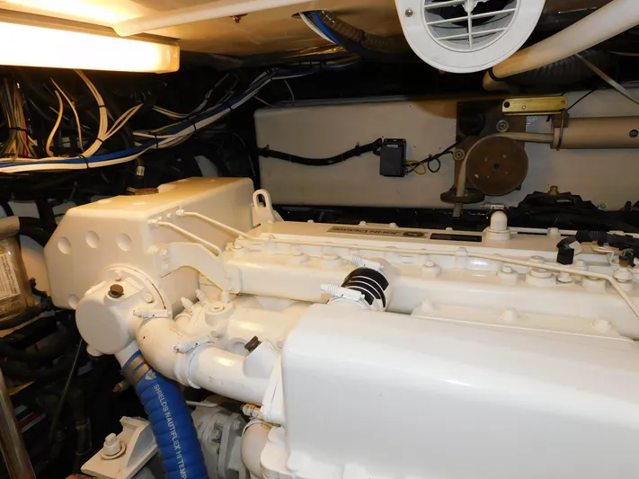 Mad Hatter Yacht Photos Pics Engine room of 1997 Tiara Yachts Open, showcasing clean, well-maintained machinery.