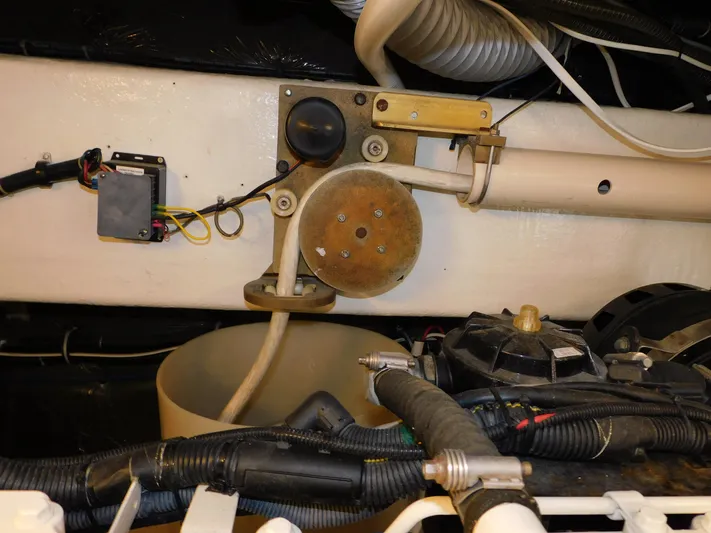 Mad Hatter Yacht Photos Pics Engine compartment of a 1997 Tiara Yachts Open, showcasing wiring and mechanical components.