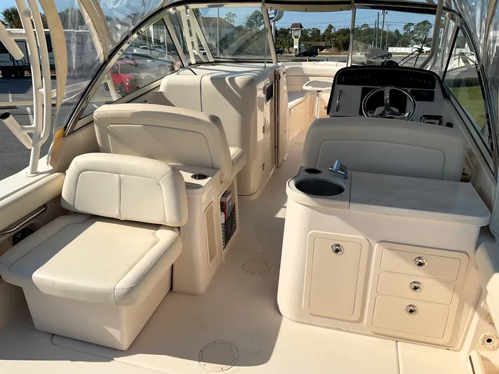  Yacht Photos Pics 2021 Grady-White Freedom 307 boat interior with seating and helm station.