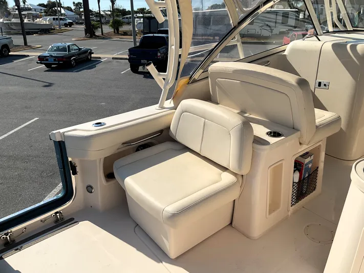  Yacht Photos Pics 2021 Grady-White Freedom 307 boat interior with comfortable seating and storage.