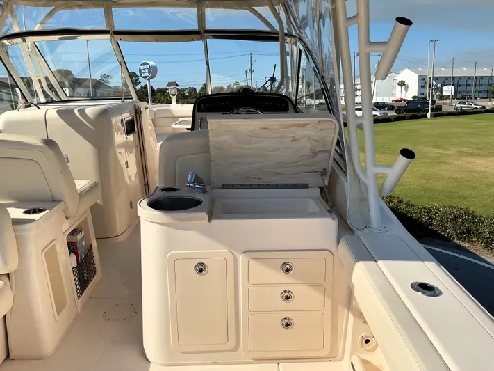  Yacht Photos Pics 2021 Grady-White Freedom 307 boat interior with seating and storage compartments.