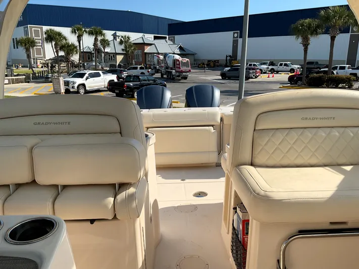  Yacht Photos Pics 2021 Grady-White Freedom 307 boat interior with beige seating and cup holders.