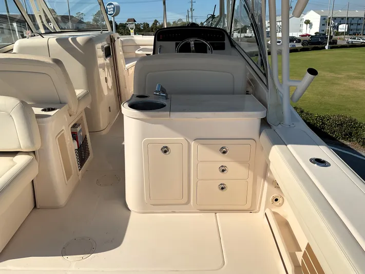  Yacht Photos Pics 2021 Grady-White Freedom 307 boat interior with seating and storage compartments.