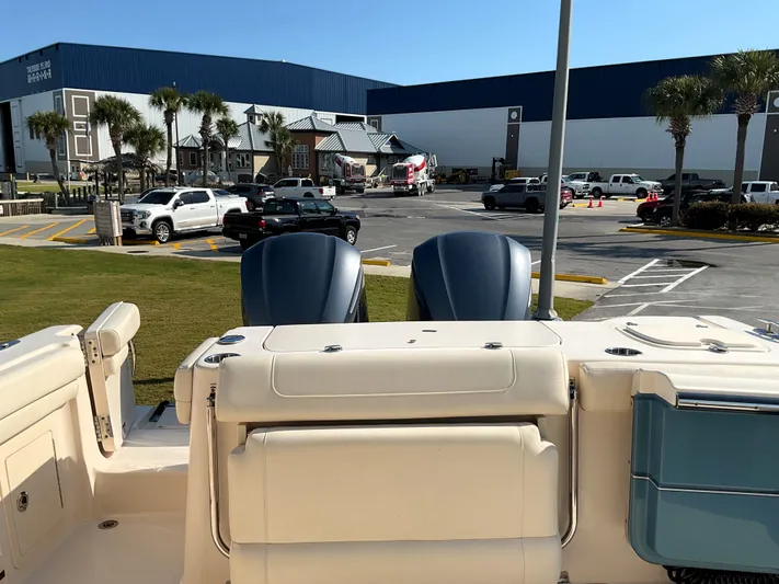  Yacht Photos Pics 2021 Grady-White Freedom 307 boat with dual engines at a marina parking lot.