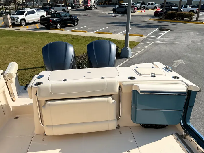  Yacht Photos Pics 2021 Grady-White Freedom 307 boat with dual engines, parked in a lot.