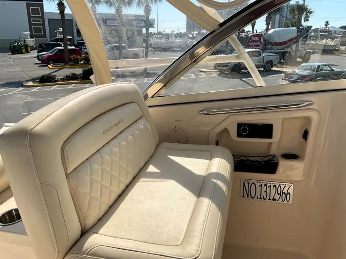  Yacht Photos Pics Interior of 2021 Grady-White Freedom 307 boat with beige seating and dashboard.