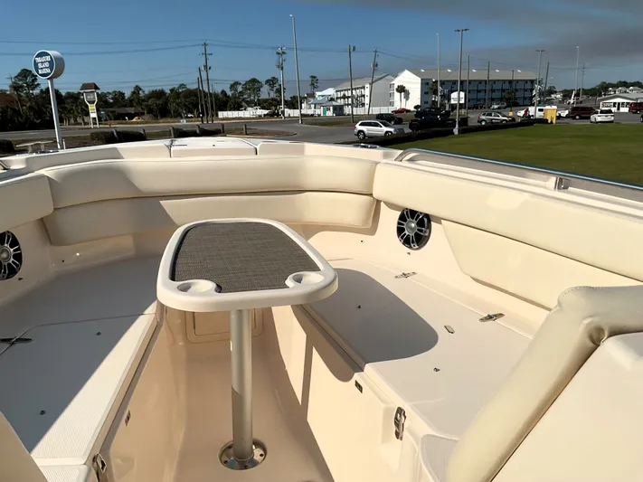  Yacht Photos Pics 2021 Grady-White Freedom 307 boat interior with seating and table, docked at marina.