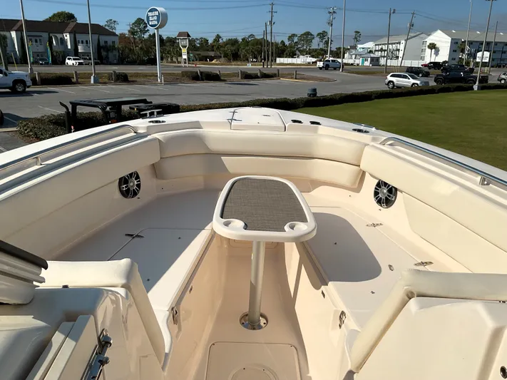 Yacht Photos Pics 2021 Grady-White Freedom 307 boat interior with seating and table, docked at marina.