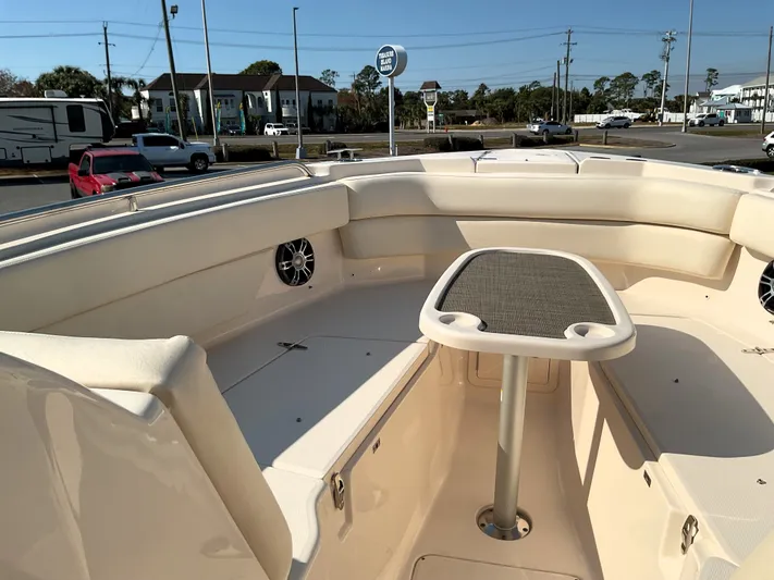  Yacht Photos Pics 2021 Grady-White Freedom 307 boat interior with seating and table, parked outdoors.