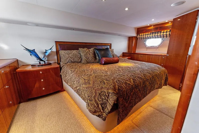 Chupacabra Yacht Photos Pics Luxurious bedroom interior of 2007 Hatteras 64 Convertible yacht with elegant bedding.