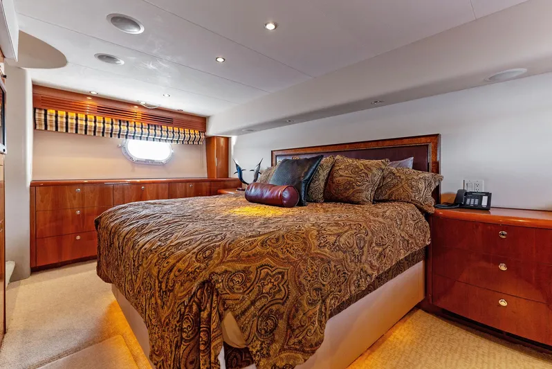 Chupacabra Yacht Photos Pics Luxurious bedroom interior of 2007 Hatteras 64 Convertible yacht with elegant bedding.