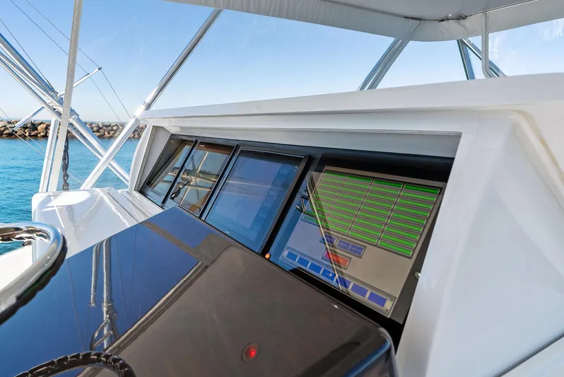 Chupacabra Yacht Photos Pics Hatteras 64 Convertible 2007 yacht helm with advanced navigation screens.