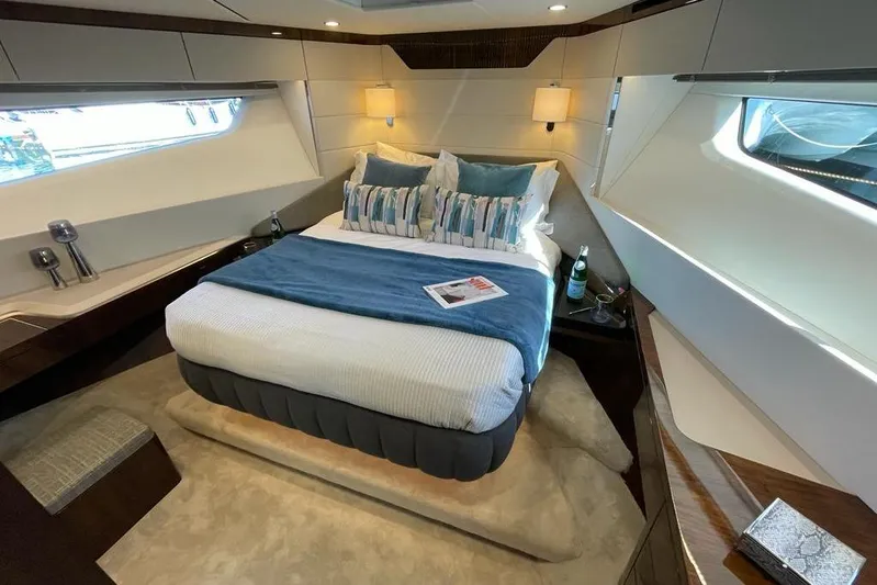 In Stock Yacht Photos Pics Luxurious bedroom interior of 2024 Fairline Squadron 58 yacht, featuring elegant design and modern amenities.