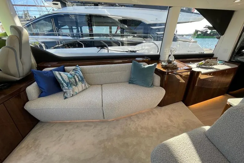 In Stock Yacht Photos Pics Luxurious interior of 2024 Fairline Squadron 58 yacht with elegant seating and decor.