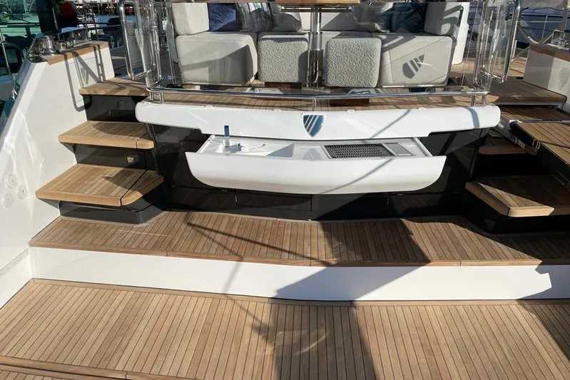 In Stock Yacht Photos Pics Luxury yacht Fairline Squadron 58, 2024 model, featuring elegant teak decking and modern seating.