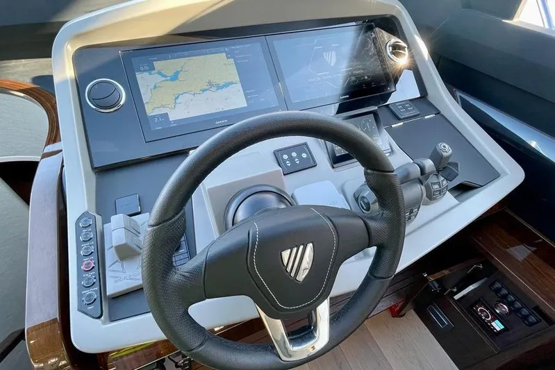 In Stock Yacht Photos Pics Cockpit of 2024 Fairline Squadron 58 yacht with advanced navigation controls and displays.