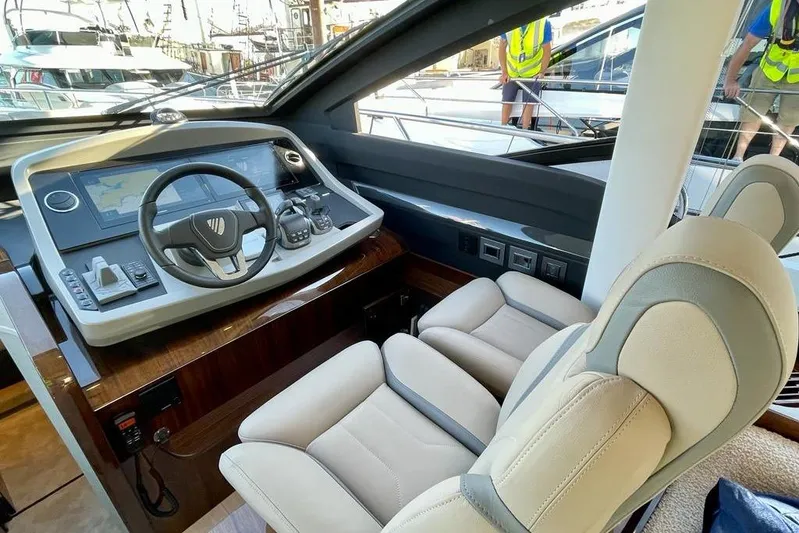 In Stock Yacht Photos Pics 2024 Fairline Squadron 58 yacht helm with modern controls and luxurious seating.
