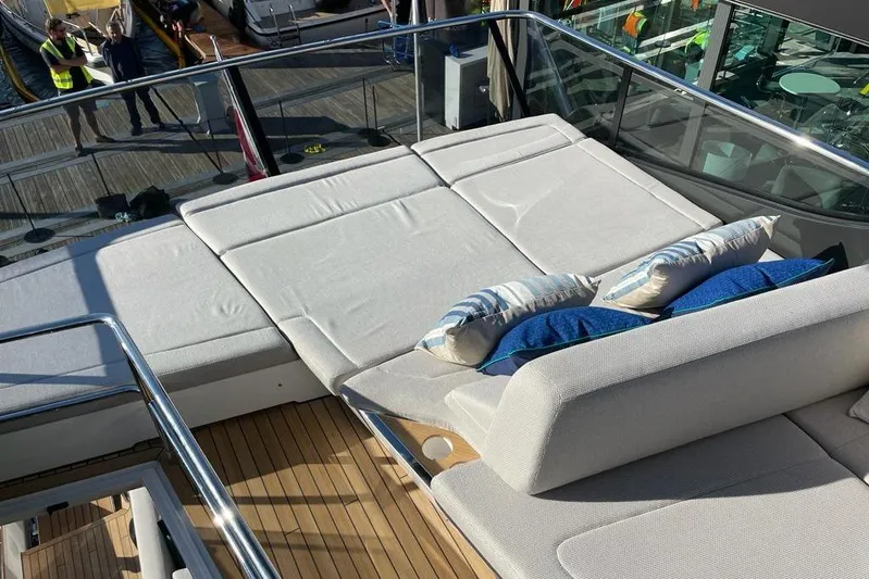 In Stock Yacht Photos Pics Luxurious sunbathing area on 2024 Fairline Squadron 58 yacht with plush cushions.