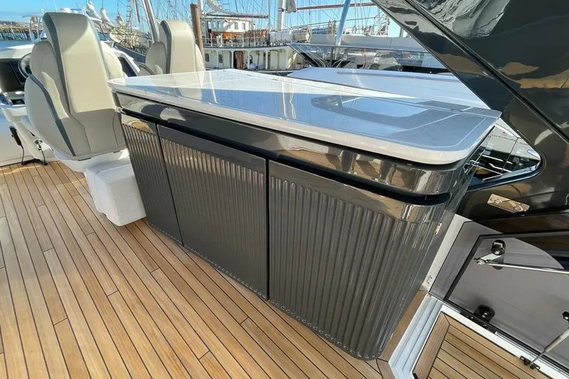 In Stock Yacht Photos Pics Luxury yacht interior with sleek design, Fairline Squadron 58, 2024 model, featuring modern seating.