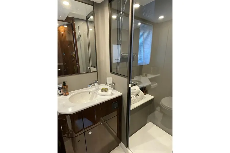 In Stock Yacht Photos Pics Luxurious bathroom in 2024 Fairline Squadron 58 yacht with modern fixtures and elegant design.