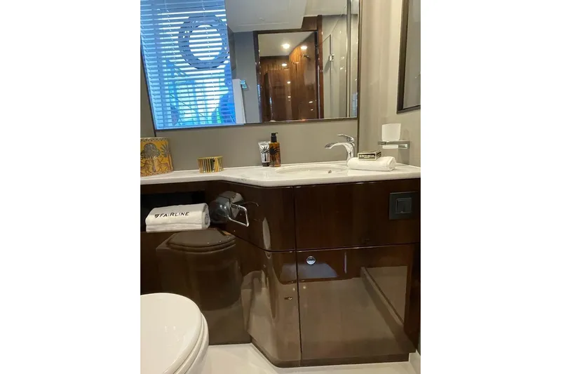 In Stock Yacht Photos Pics Luxurious bathroom in 2024 Fairline Squadron 58 yacht with modern fixtures and elegant design.