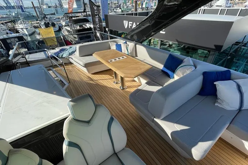 In Stock Yacht Photos Pics Luxurious 2024 Fairline Squadron 58 yacht deck with elegant seating and table.