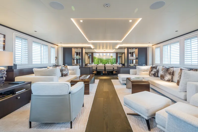 Emerald Yacht Photos Pics Luxurious Feadship yacht interior, featuring elegant seating and modern lighting, built in 1990.