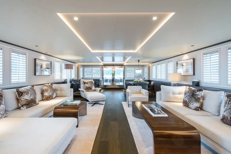 Emerald Yacht Photos Pics Luxurious interior of 1990 Feadship yacht with elegant seating and modern decor.