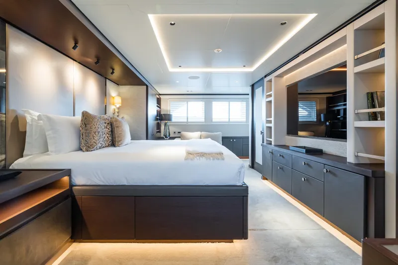 Emerald Yacht Photos Pics Luxurious Feadship yacht bedroom interior with modern design, ambient lighting, and elegant furnishings, 1990 model.