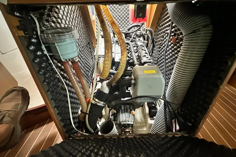  Yacht Photos Pics Engine compartment of 2007 Jeanneau Sun Odyssey 42 DS sailboat, showcasing mechanical components.